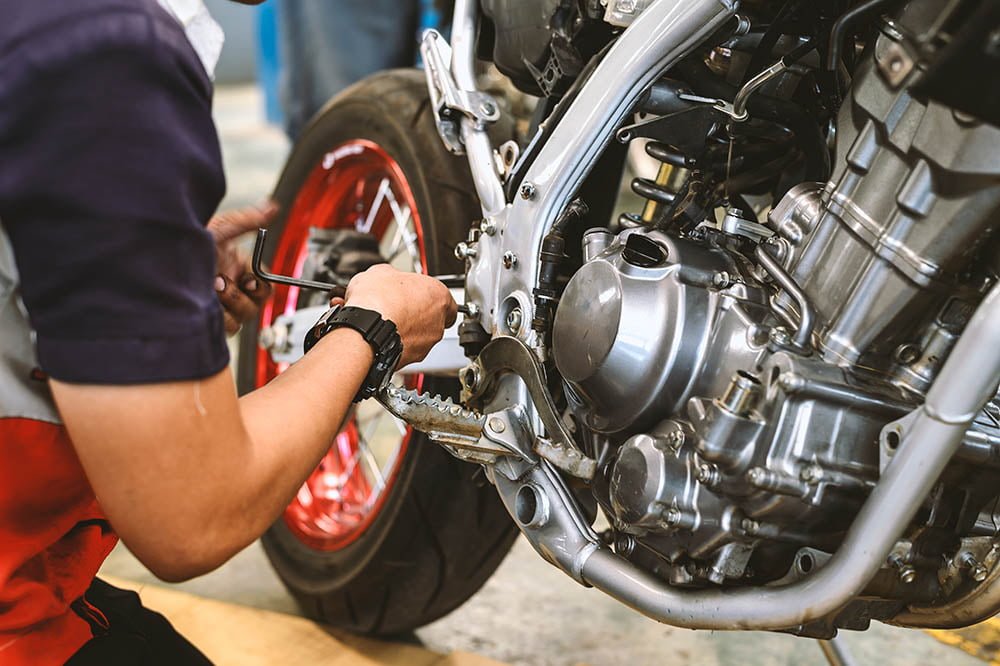 motorcycle engine repair with soft-focus and over light in the b