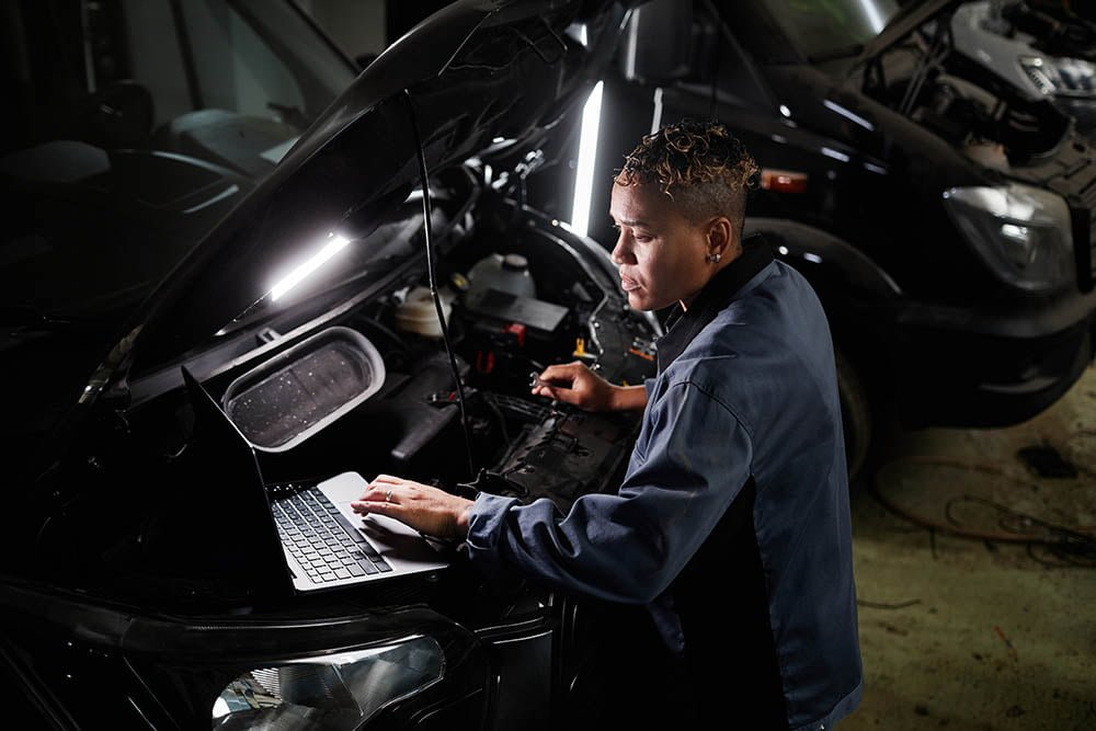 Female Mechanic Working In Garage